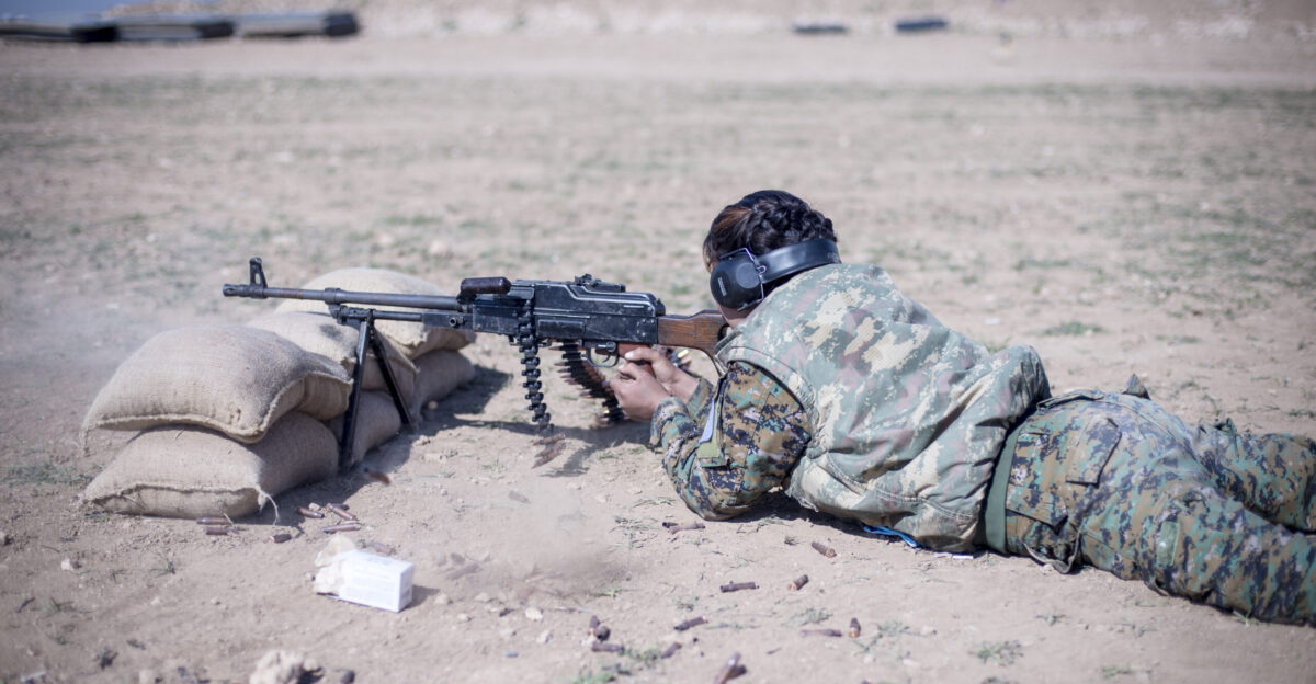 A local female Manbij Military Council trainee fires a 7 62mm PK machine gun during marksmanship training Feb 21 2017 at Sanaa Training Center in Northwest Syria The instruction is 20 days long to include basic rifle marksmanship and squad level weapons and movement techniques This is the first cycle of women to graduate and join the MMC The course is administered by Special Operations Joint Task Force - Operation Inherent Resolve trainers U S Army photo by Master Sgt Mark Burrell CJTF-OIR